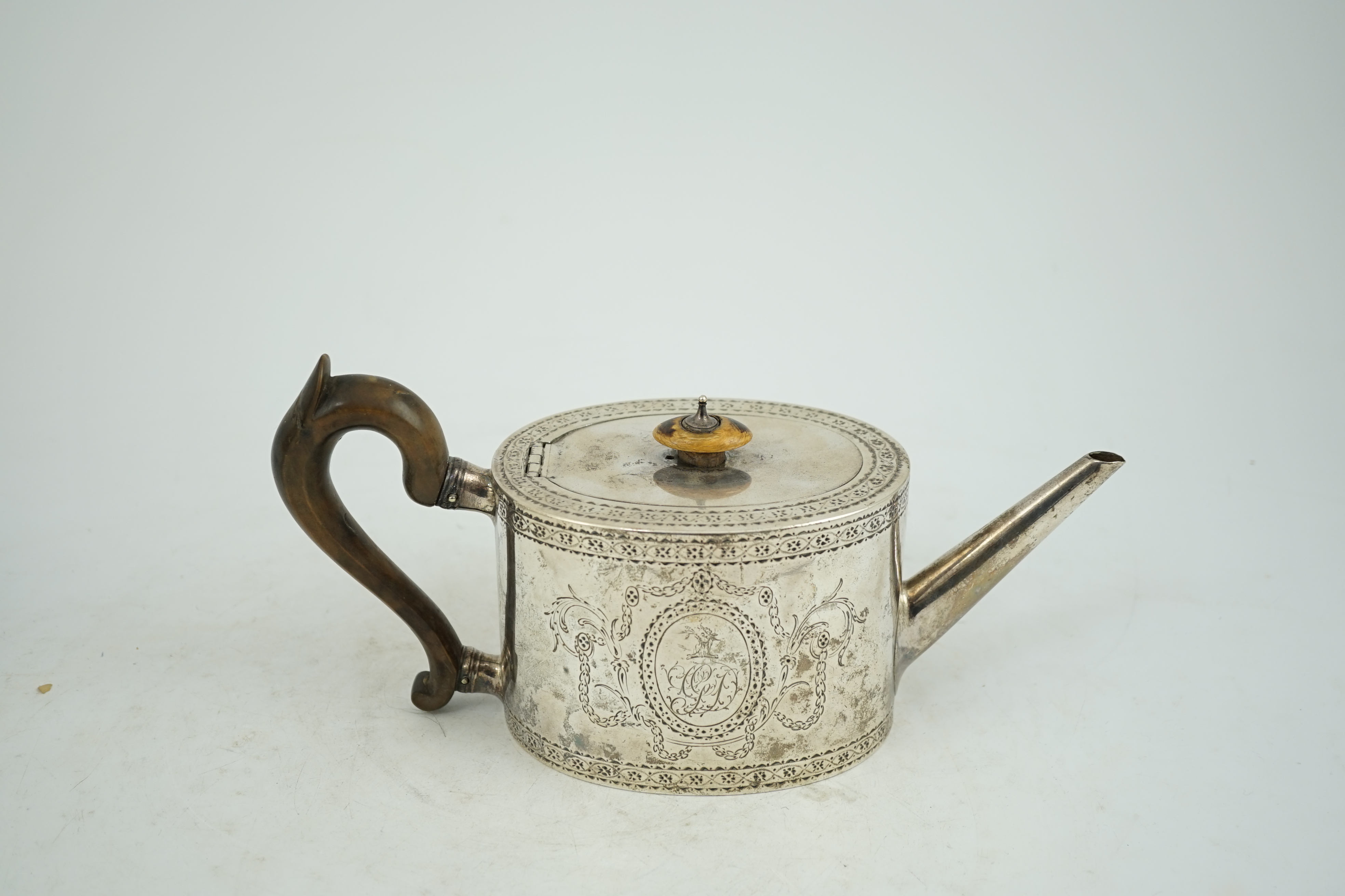 A George III engraved silver oval teapot, London, 1777, gross weight 16.5oz. CITES Submission reference KVNULT5X